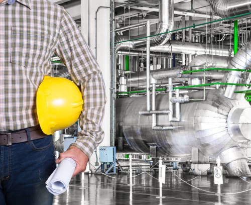 Maintenance technician inside thermal power plant factory Maintenance technician inside thermal power plant factory